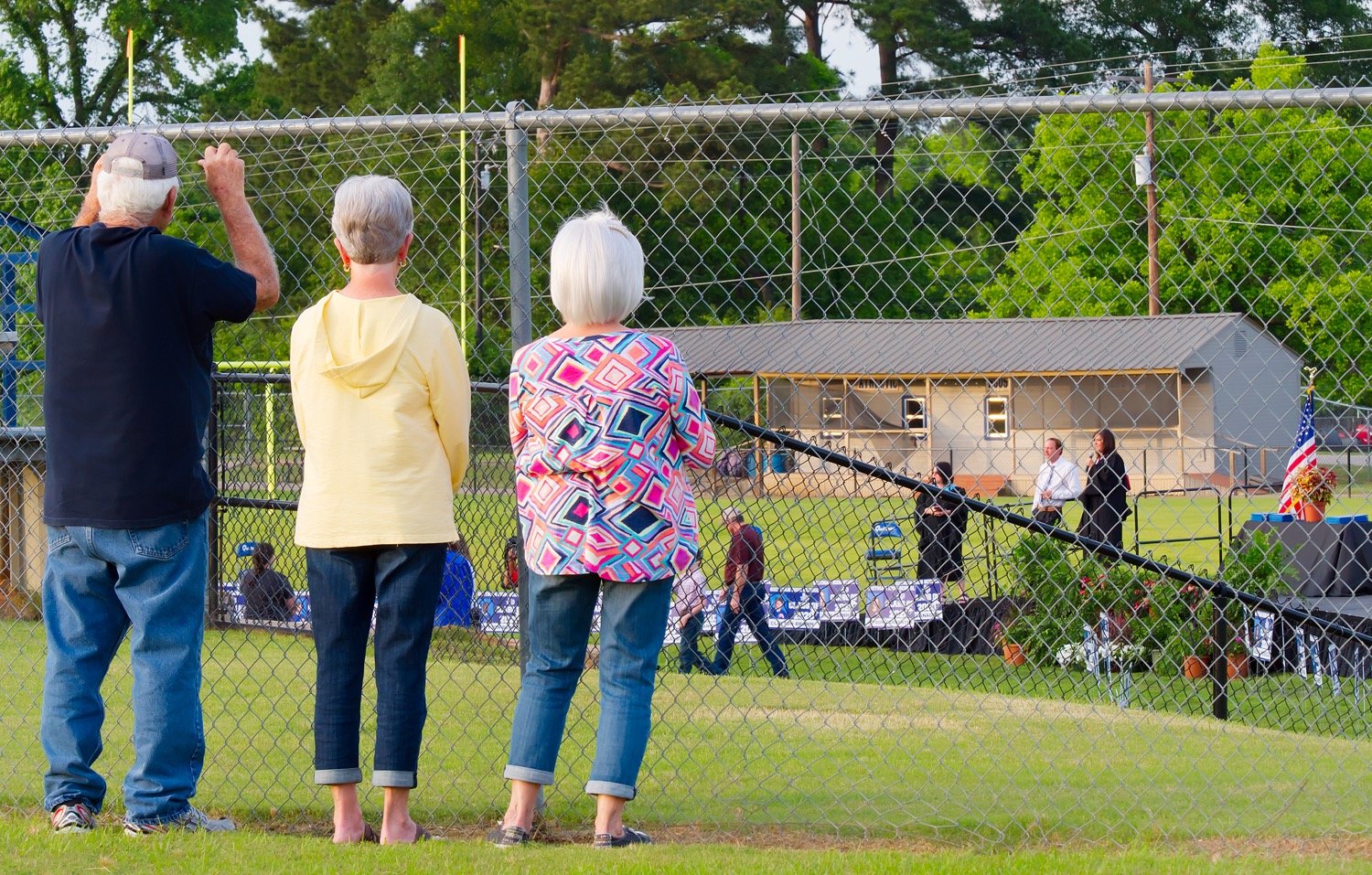 Graduates could have four family members accompany them onto the field for a group photo and get a front row seat to their walk across the stage, but that didn't keep some friends and extended family members from witnessing the Quitman graduates walk from outside the stadium.